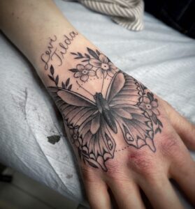 hand butterflies tattoo